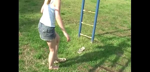  Young teen plays in the park and flashes her body
